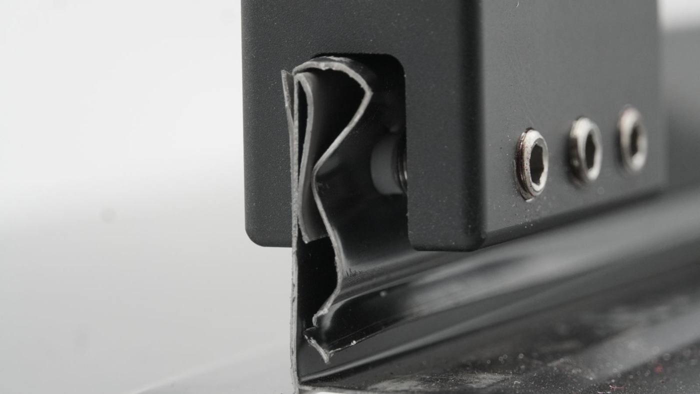 Universal Clamp channel locked around the standing seam profile, screw holes ready for set screws
